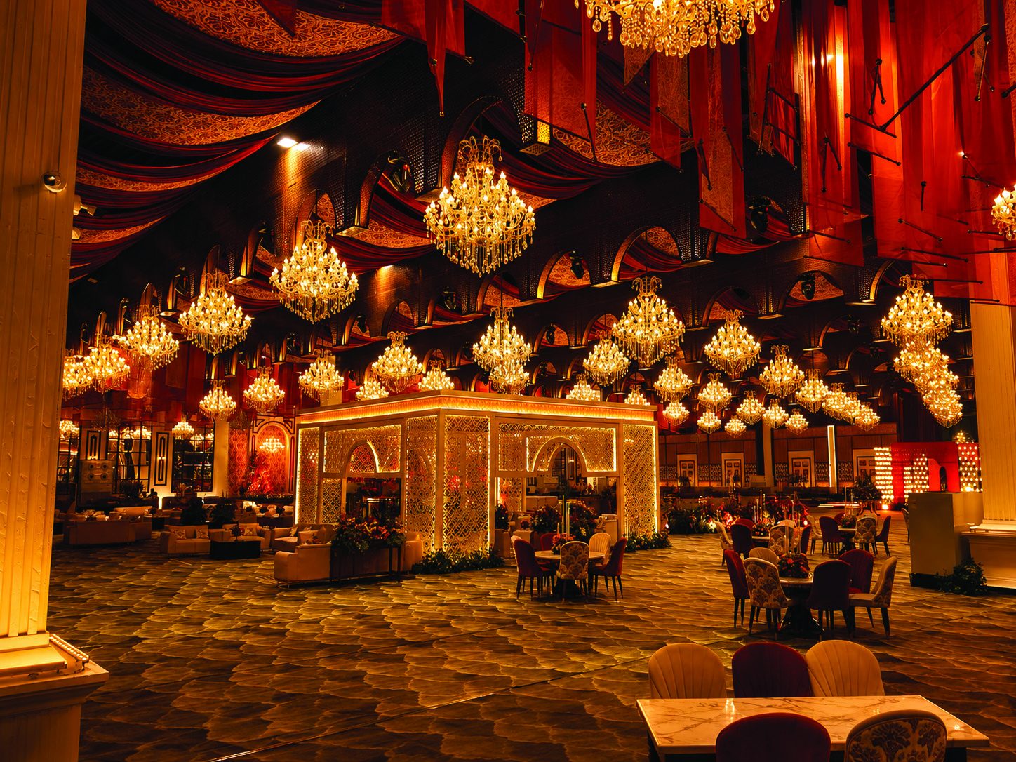 A constellation of golden chandeliers in The Palace hall